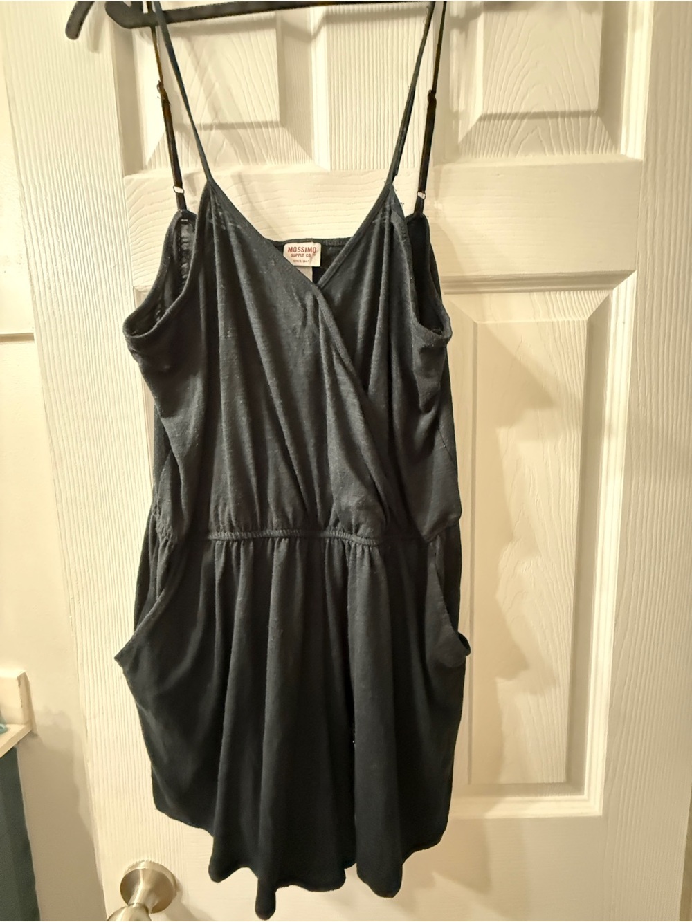 Black Sleeveless Faux-Wrap Romper with Pockets